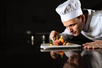 "Expert Chef de Cuisine creating exquisite, gourmet dishes with passion and precision, offering a refined culinary experience in fine dining restaurants.